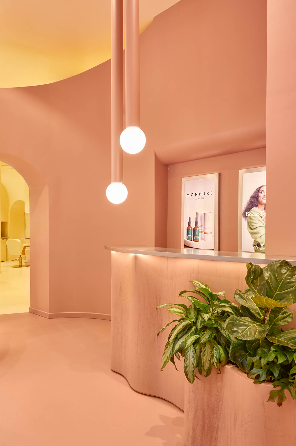 Peachy colors fill interiors of a beauty salon by Masquespacio in Milan 