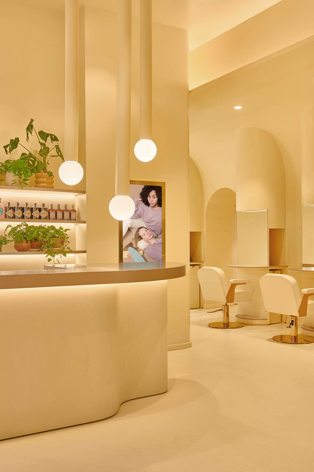 Peachy colors fill interiors of a beauty salon by Masquespacio in Milan 