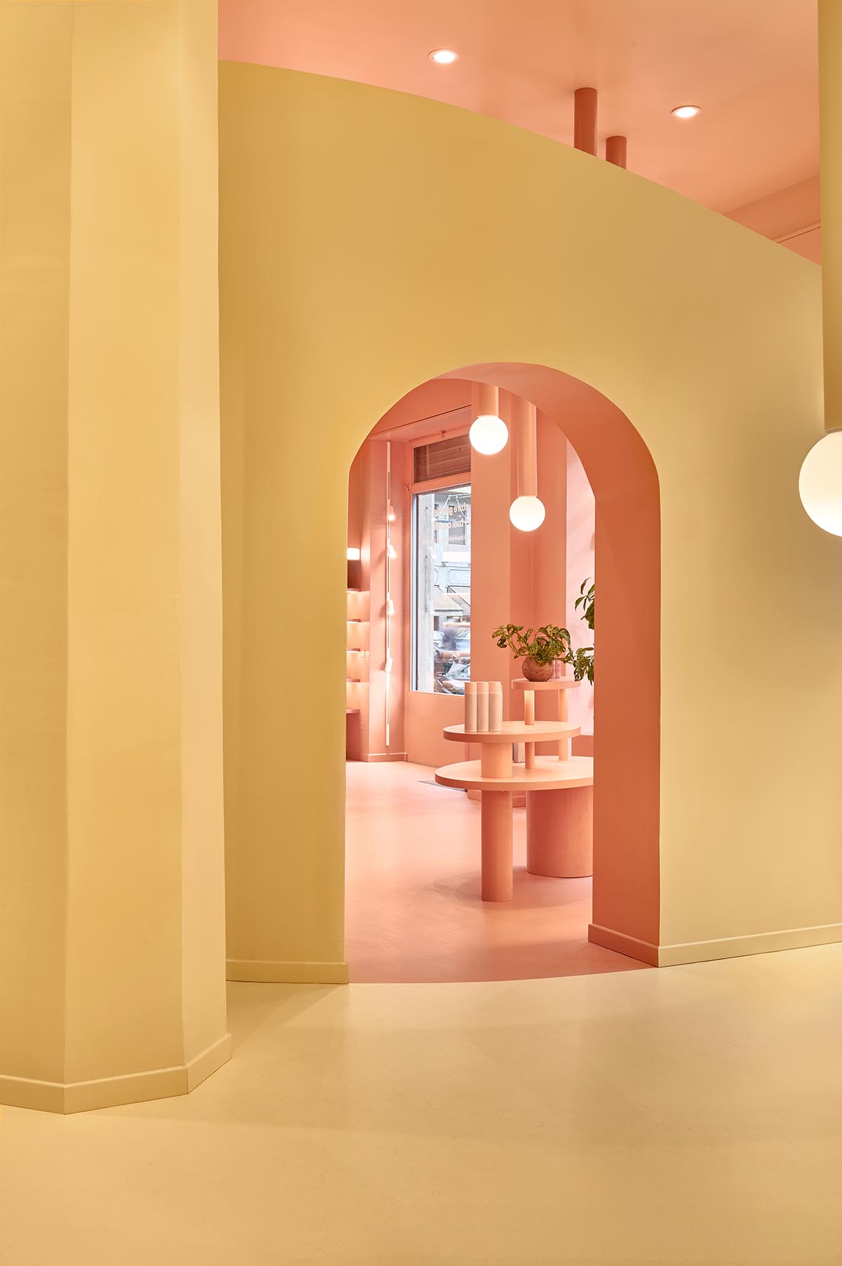 Peachy colors fill interiors of a beauty salon by Masquespacio in Milan 