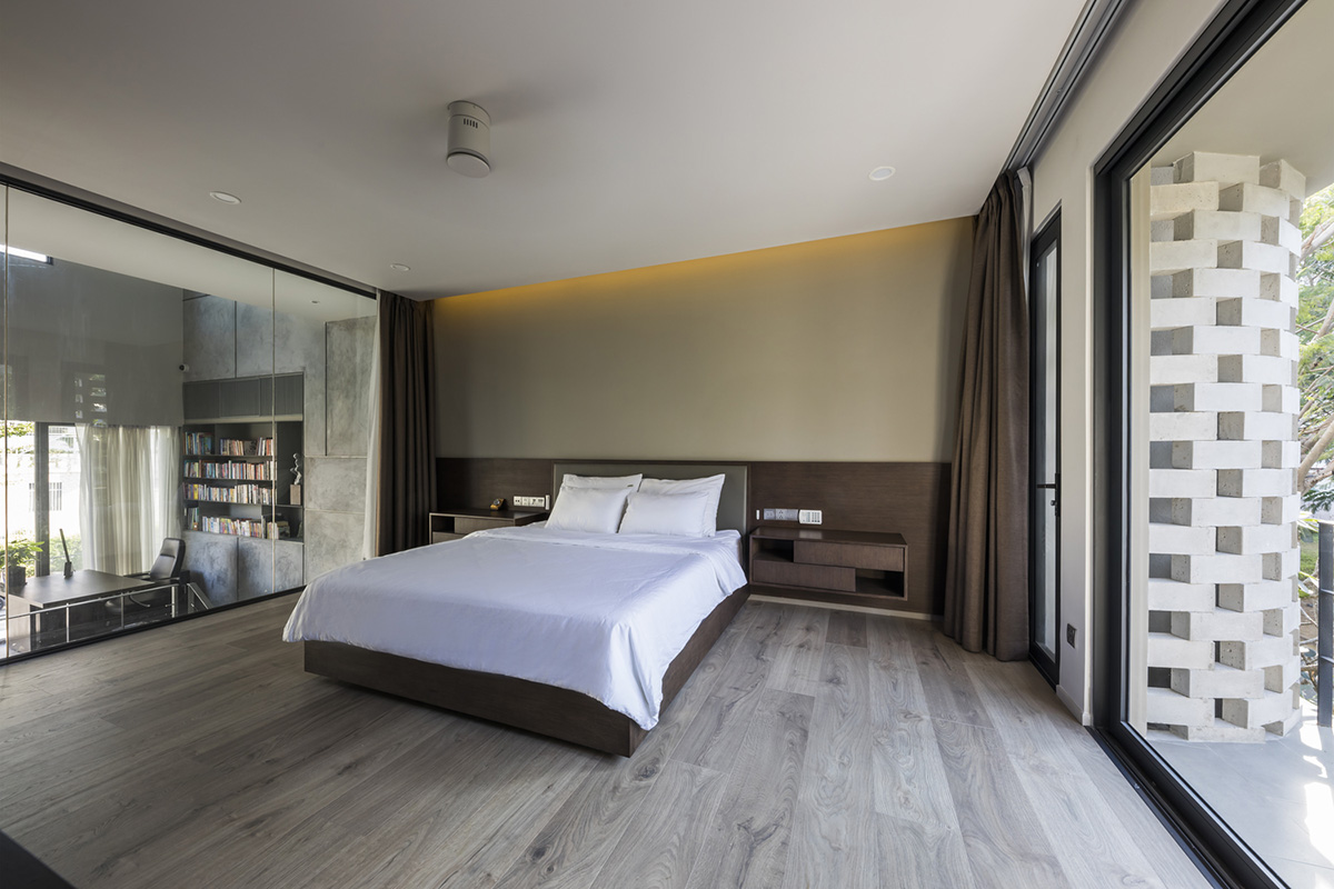 Nha Dan Architects built this house with porous facade to provide maximum thermal comfort in Vietnam