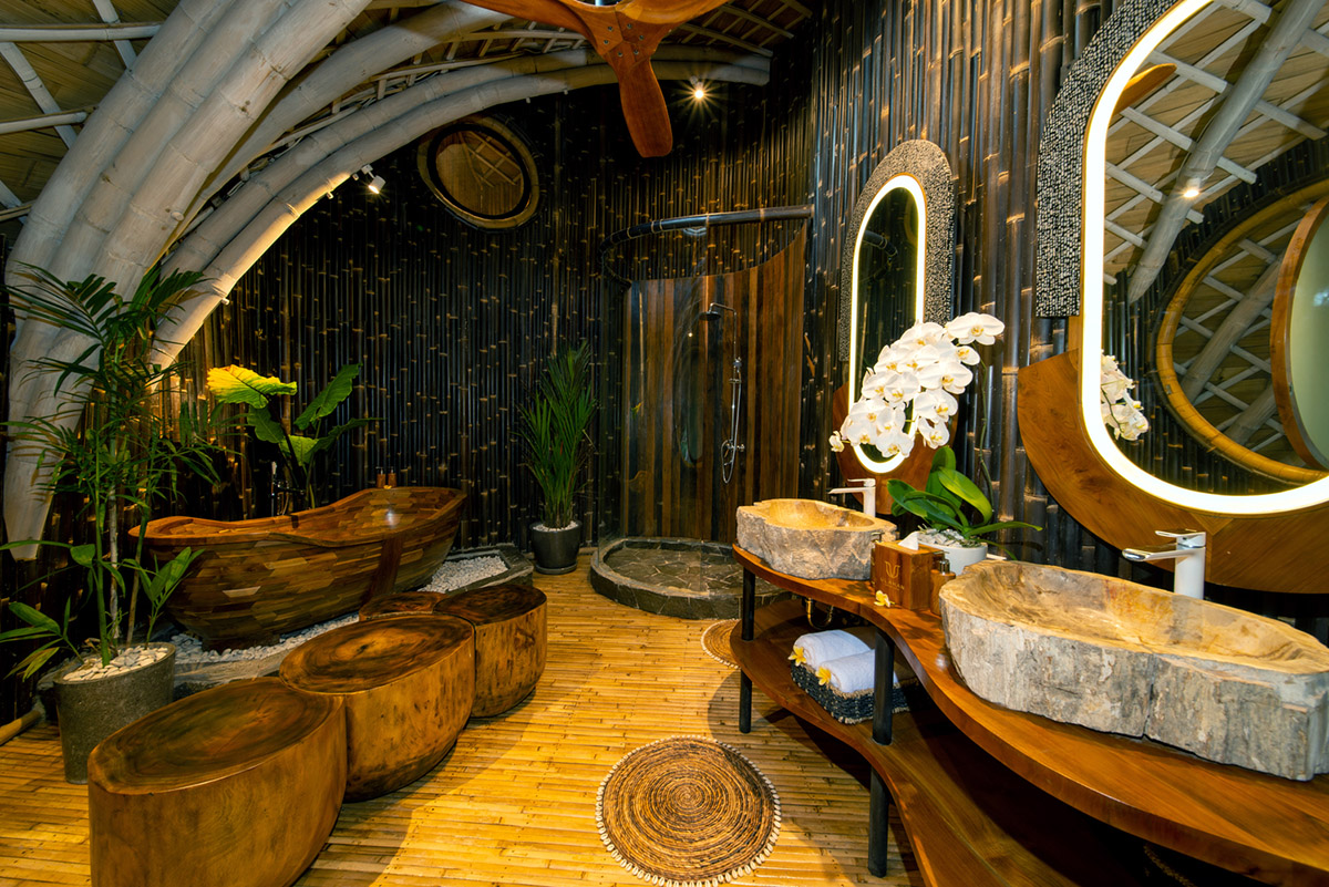 Undulating bamboo roofs wrap this wellness retreat in a lush forest of Bali