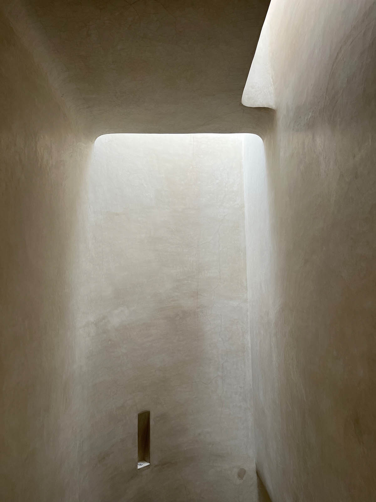 Hotel features recessed windows and earth-clad palette evoking rich artisanal heritage of Morocco 