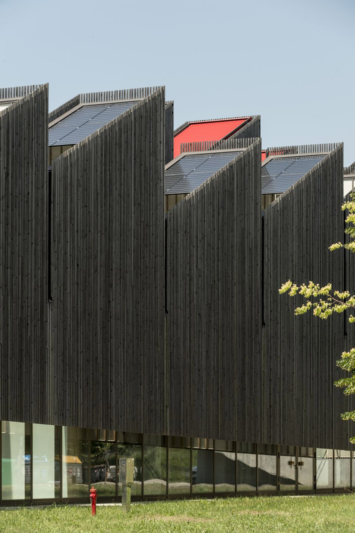Mario Cucinella Architects designs ARPAE headquarters with chimney-shaped roofs in Ferrara, Italy