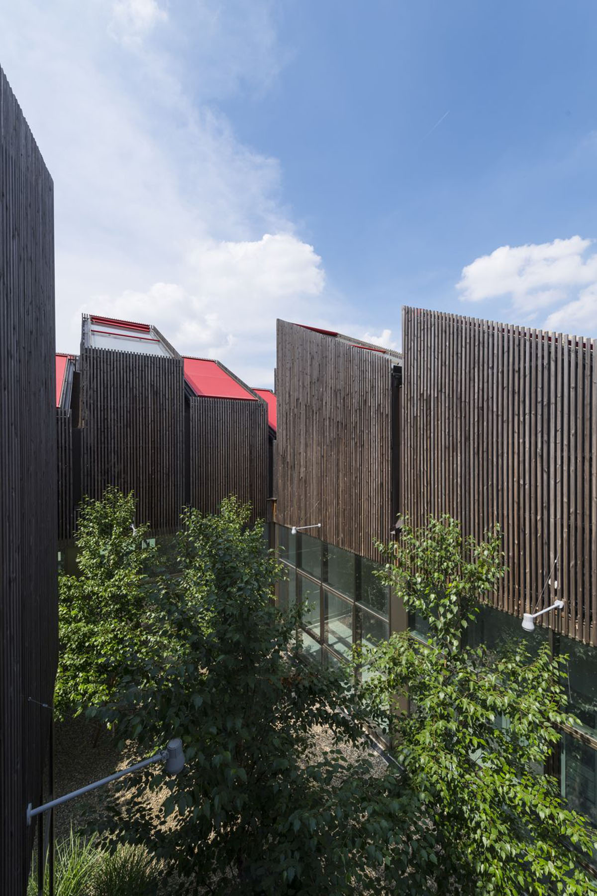 Mario Cucinella Architects designs ARPAE headquarters with chimney-shaped roofs in Ferrara, Italy