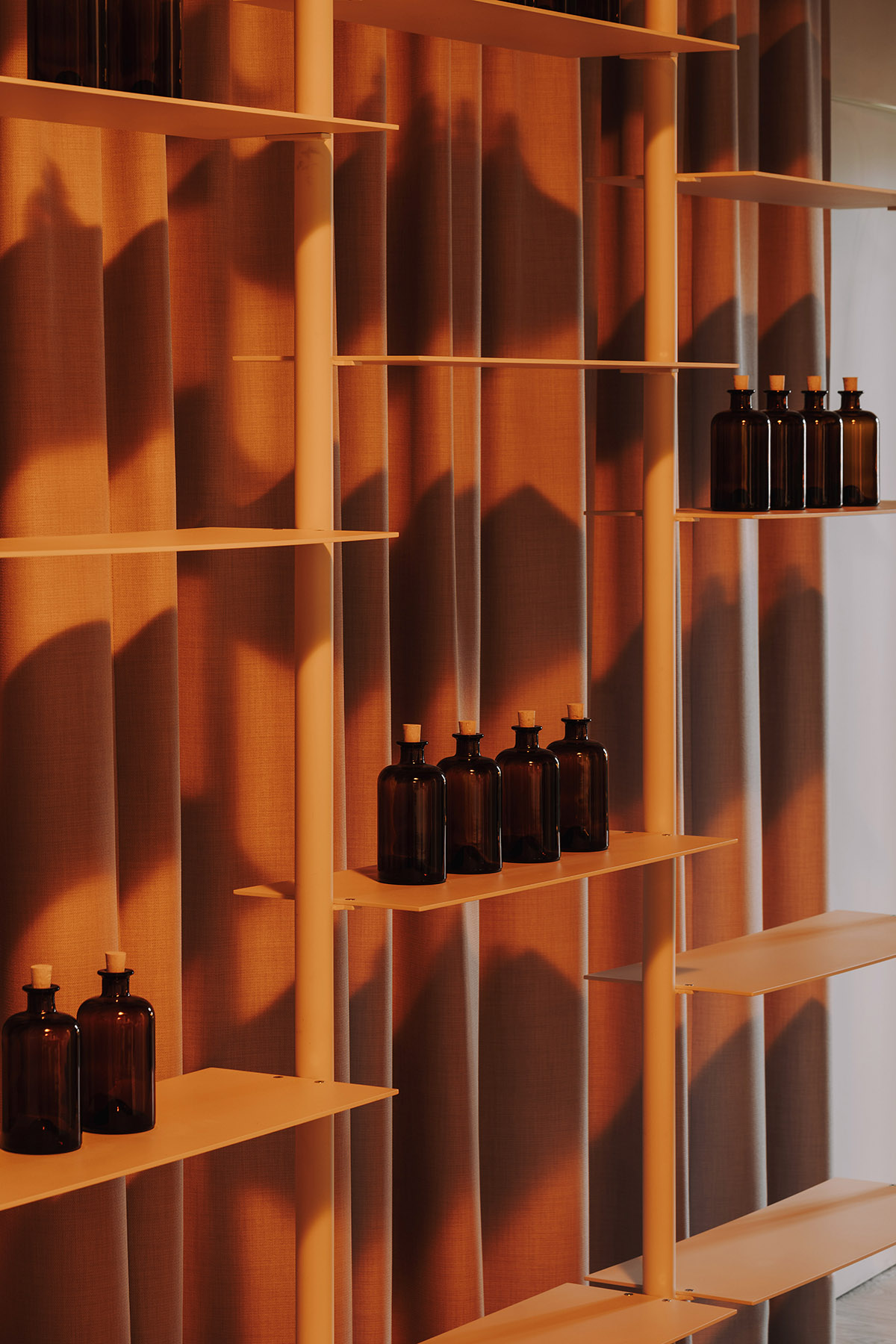 This copper-hued co-working space interior is designed to inspire creative work in Wrocław