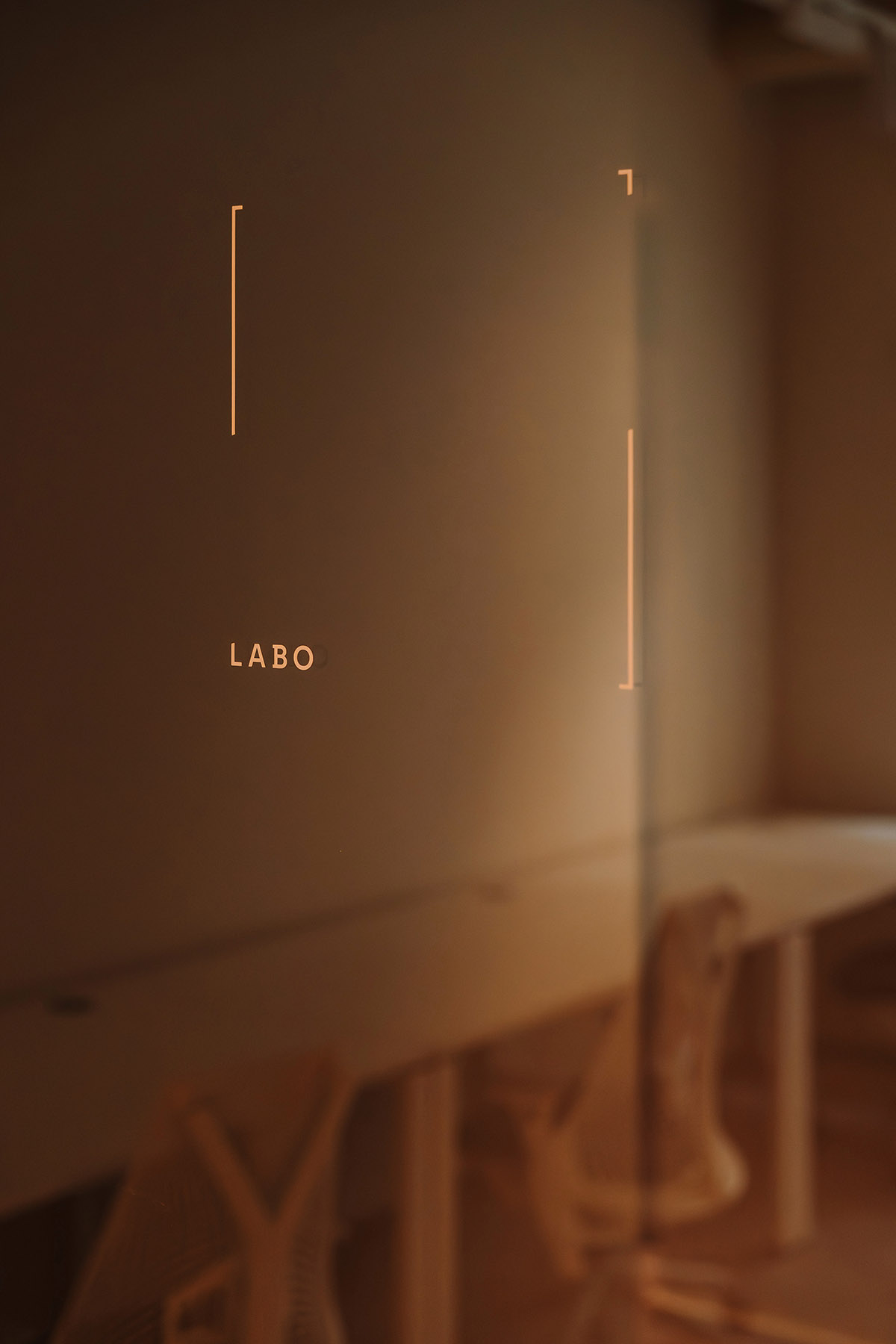 This copper-hued co-working space interior is designed to inspire creative work in Wrocław