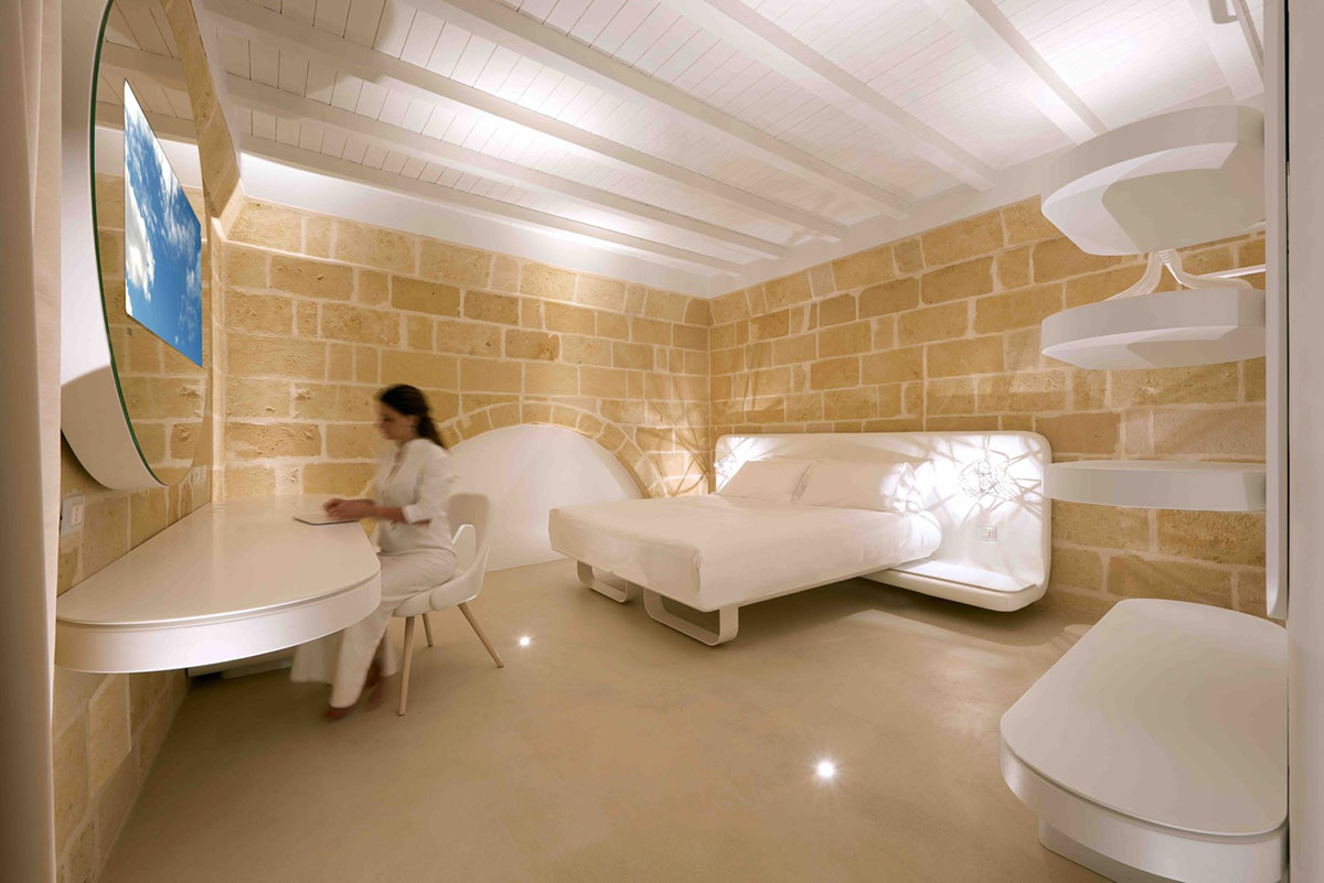 Interiors of this cave hotel and spa by Simone Micheli act like work of art with excavated surfaces