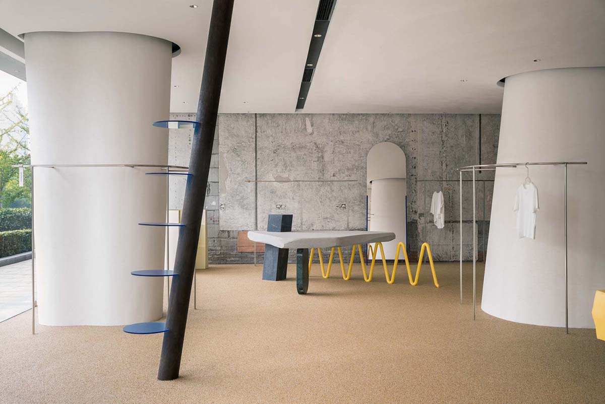 Cheese-like and stone tables with pinkish quirky-shaped elements add more personality to DSC store