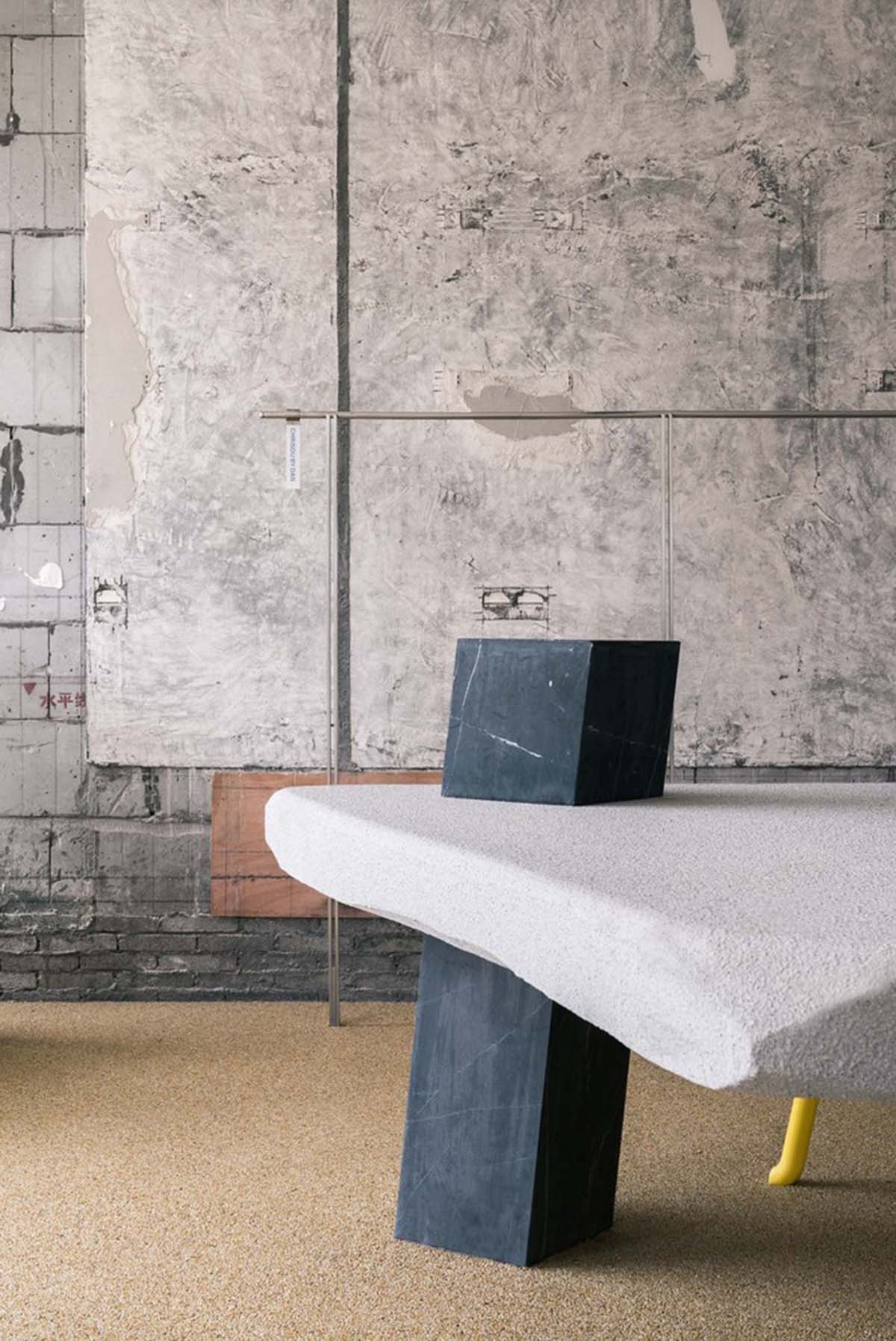 Cheese-like and stone tables with pinkish quirky-shaped elements add more personality to DSC store