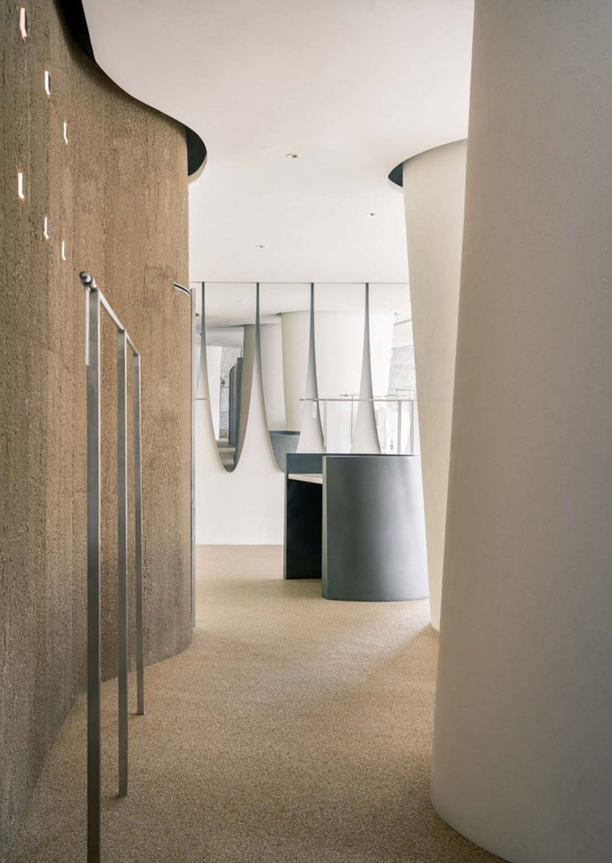 Cheese-like and stone tables with pinkish quirky-shaped elements add more personality to DSC store