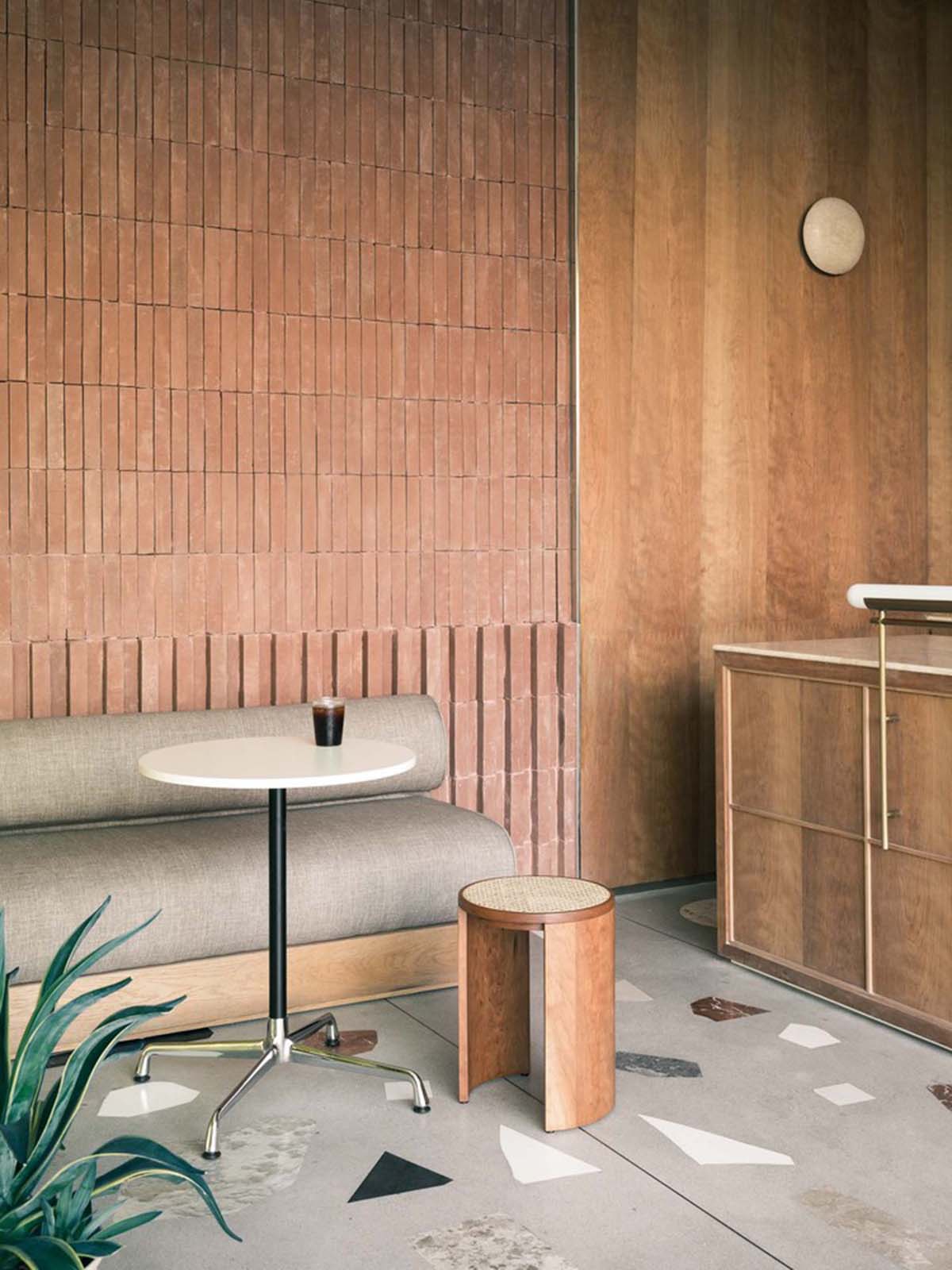 Cheese-like and stone tables with pinkish quirky-shaped elements add more personality to DSC store