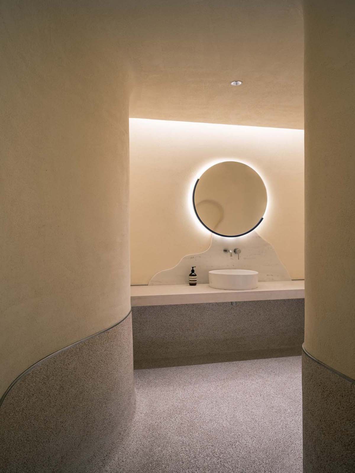 Cheese-like and stone tables with pinkish quirky-shaped elements add more personality to DSC store