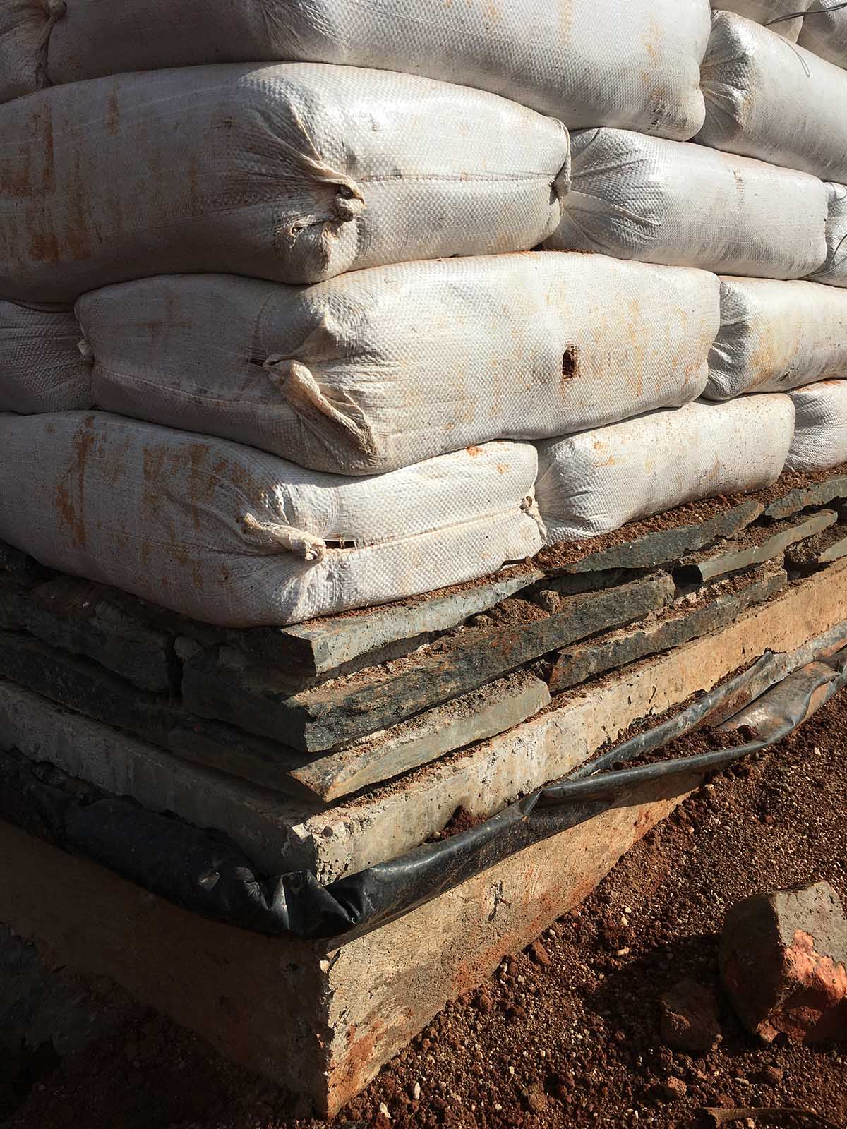 Localworks built junior school with organically shaped classrooms made of earthbags in Uganda 