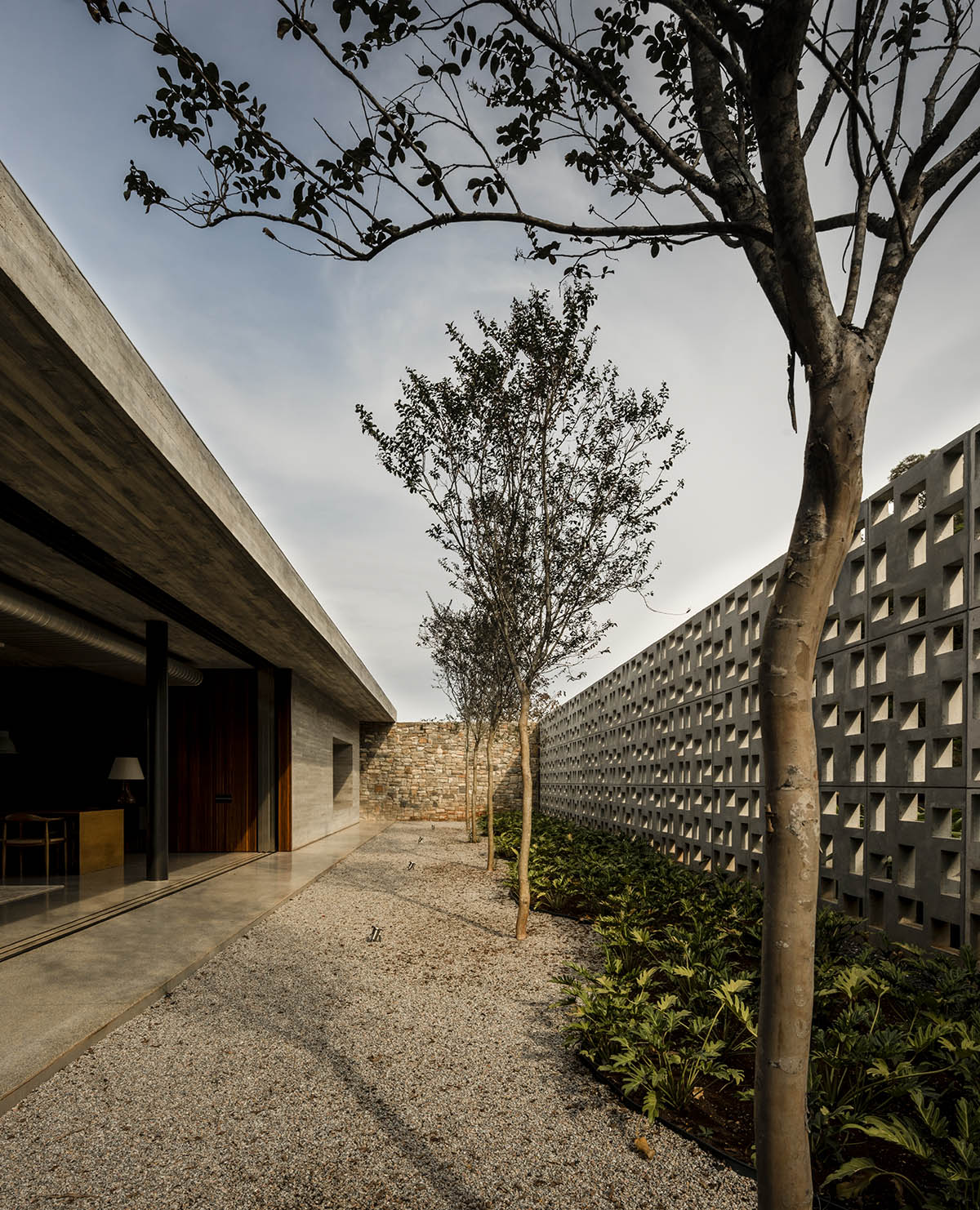 Studio MK27 Hides Elegantly Private Residence With Perforated Wall In A Poetic Landscape Of Brazil