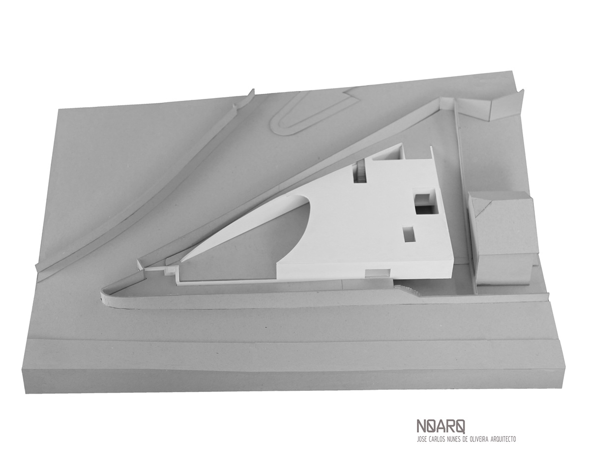 NOARQ designs smooth curvy-roof for Portuguese house to adapt to topography and create courtyards