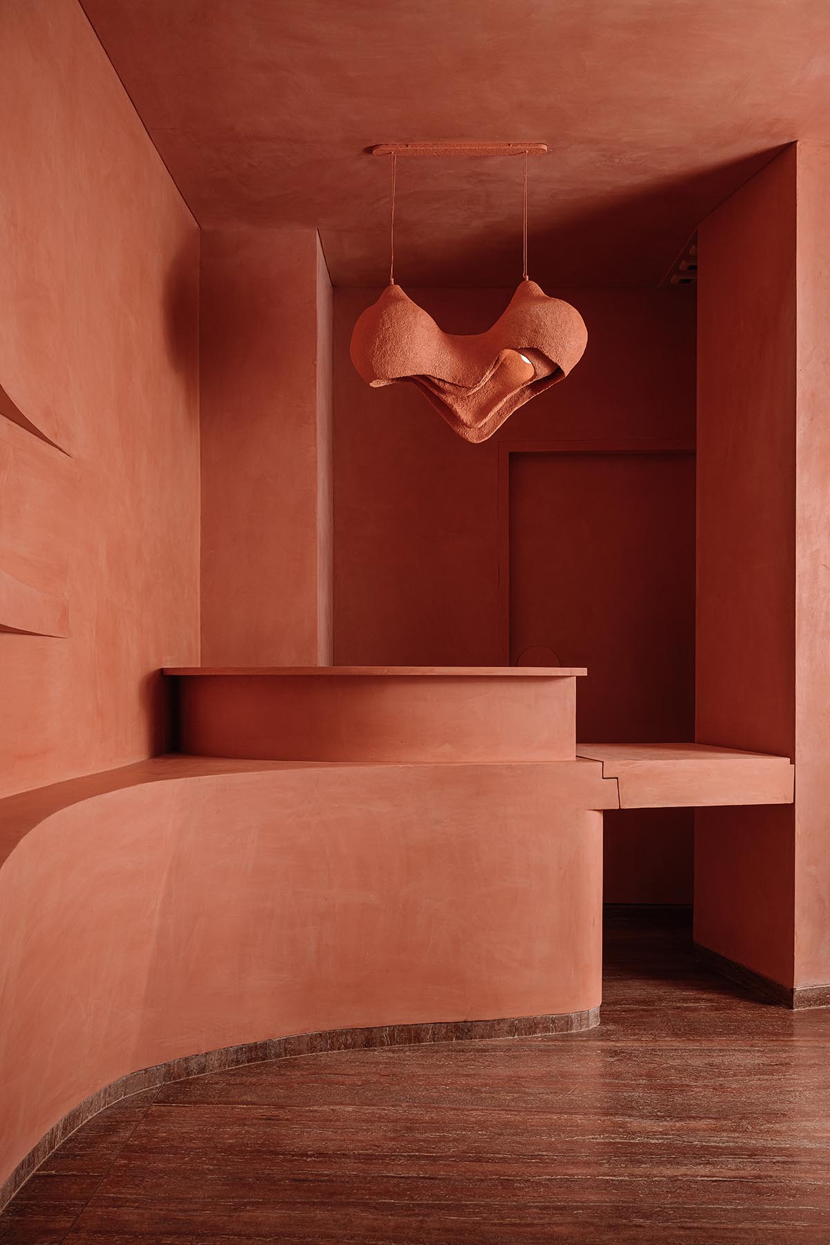Indian jewellery boutique by MuseLAB features terracotta-doused interiors creating a sinuous island