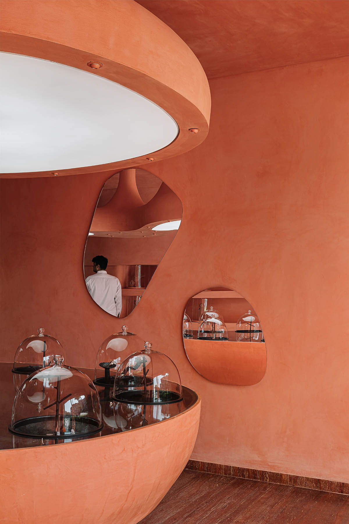 Indian jewellery boutique by MuseLAB features terracotta-doused interiors creating a sinuous island