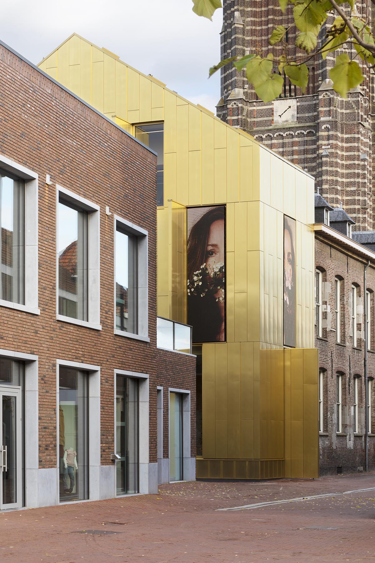 Maurice Mentjens renovates historic municipal museum with gold-skinned exterior in the heart of Weert