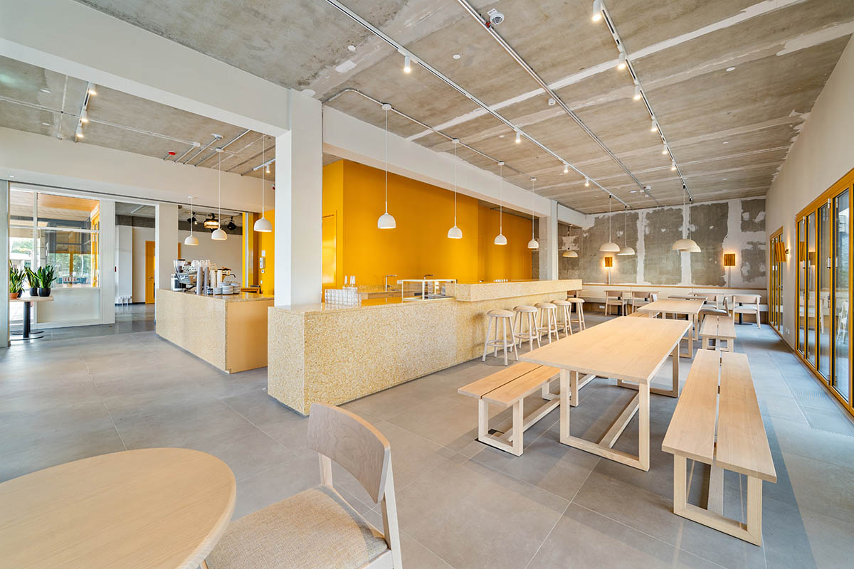 MVRDV revives old office building with bright yellow façade and zigzagging staircase in Berlin