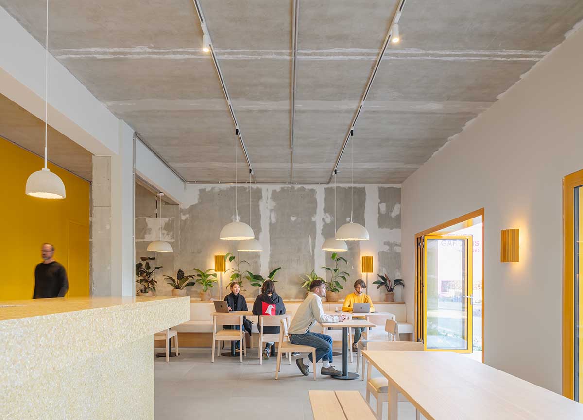 MVRDV revives old office building with bright yellow façade and zigzagging staircase in Berlin