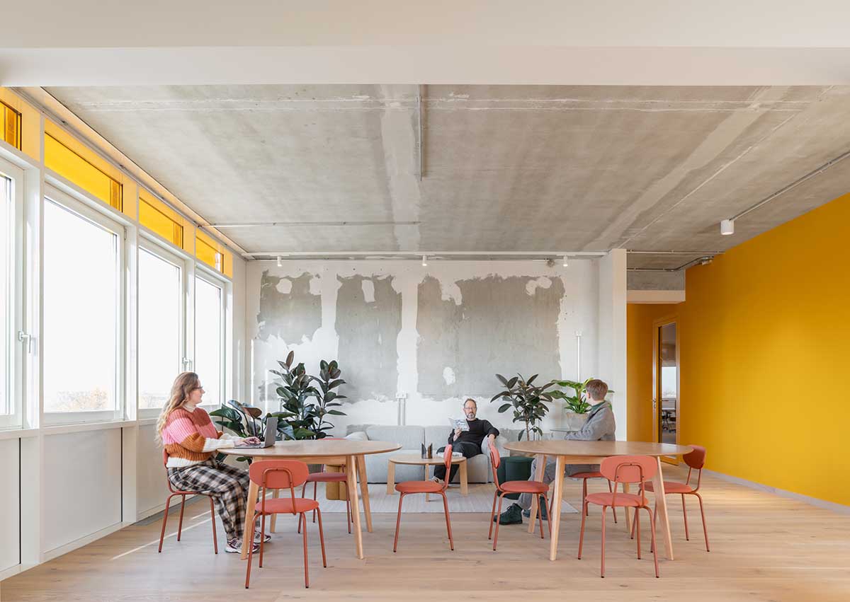 MVRDV revives old office building with bright yellow façade and zigzagging staircase in Berlin