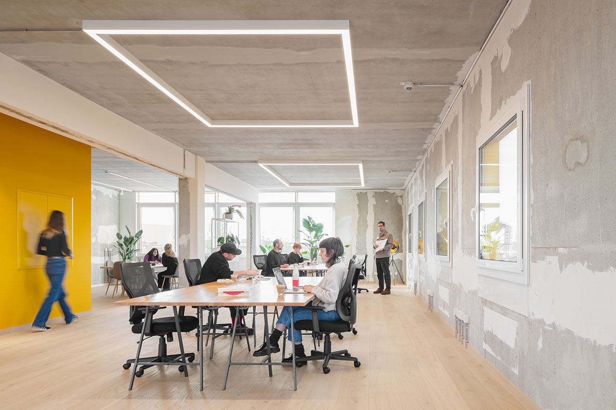 MVRDV revives old office building with bright yellow façade and zigzagging staircase in Berlin