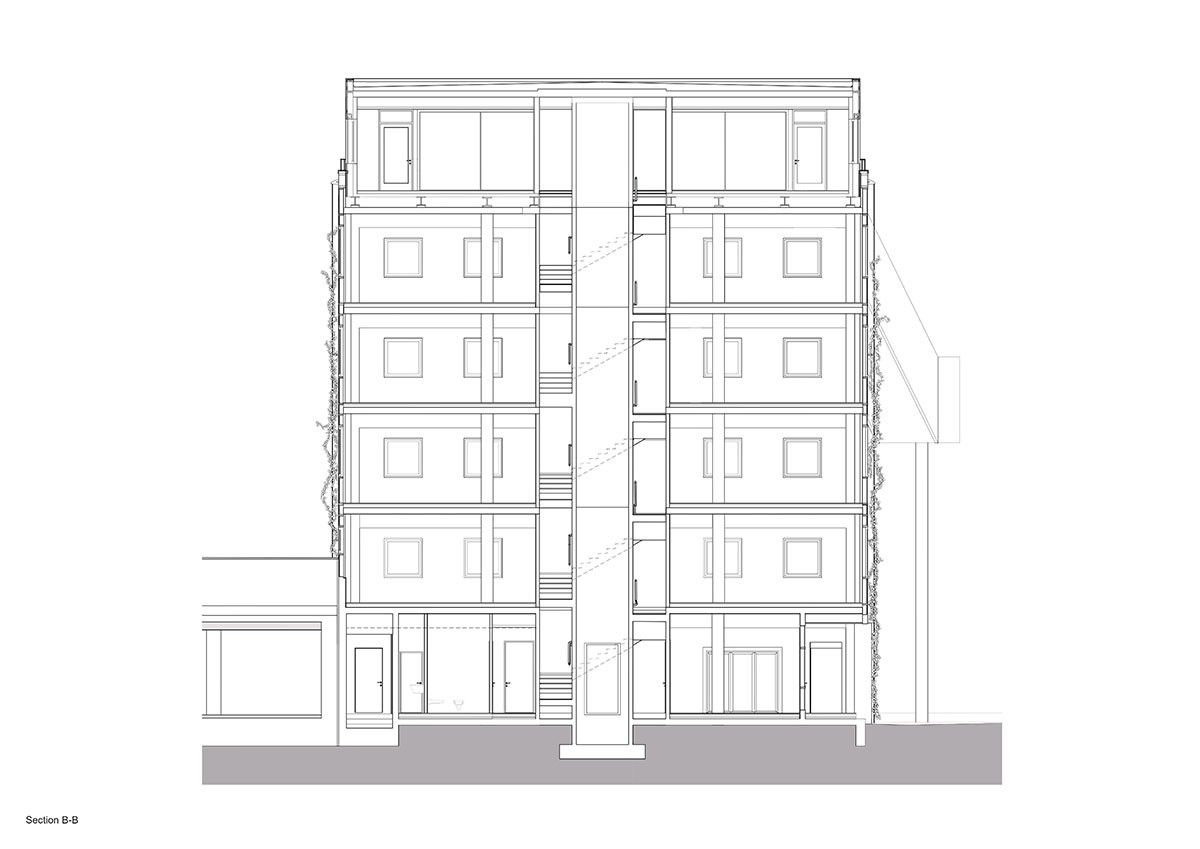 MVRDV revives old office building with bright yellow façade and zigzagging staircase in Berlin