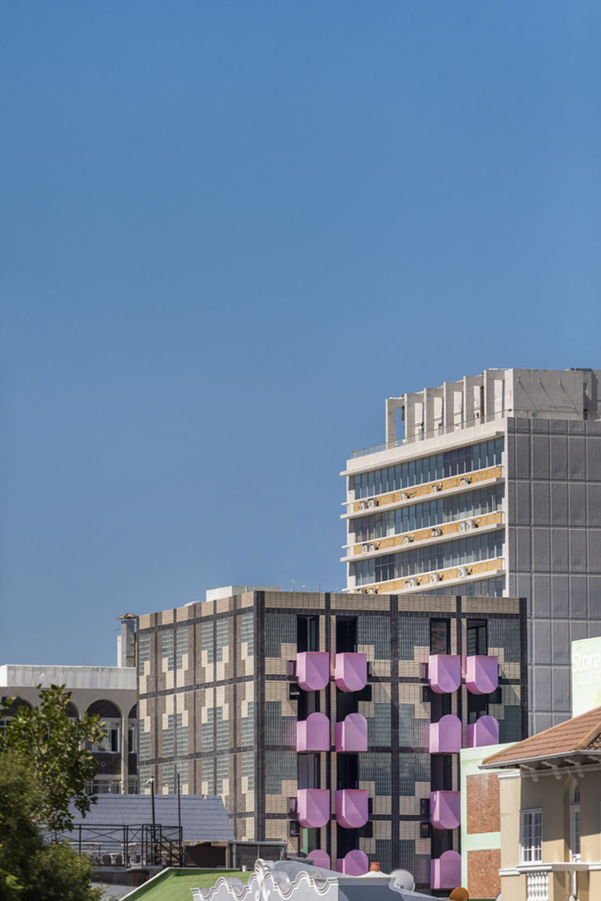 Two Five Five Architects adds protruding bright pink marshmallow balconies to apartment in Cape Town