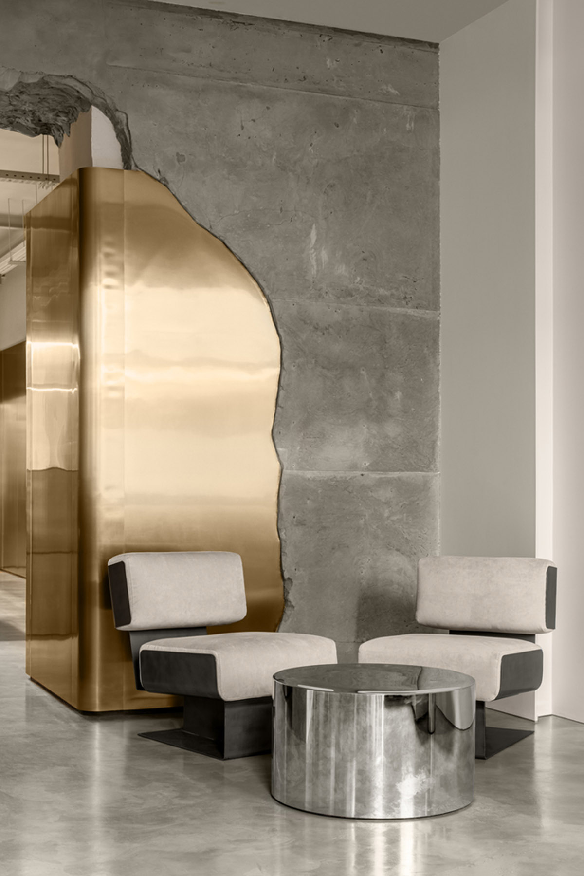 Cast-in-situ concrete, golden panels, metallic curtains soften beauty salon designed by balbek bureau