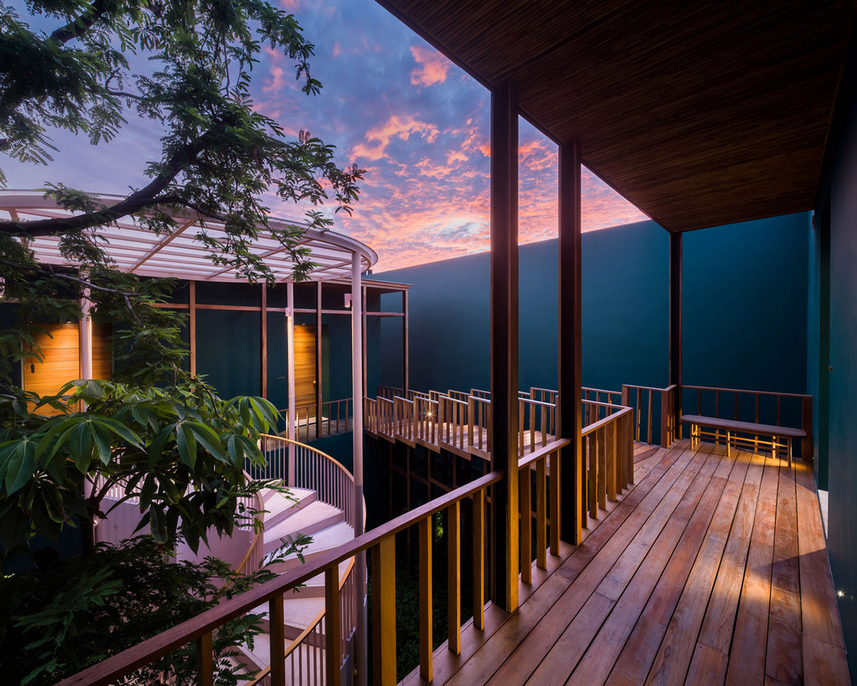 onion combines white concave and convex walls with colorful surfaces for beach resort in Thailand