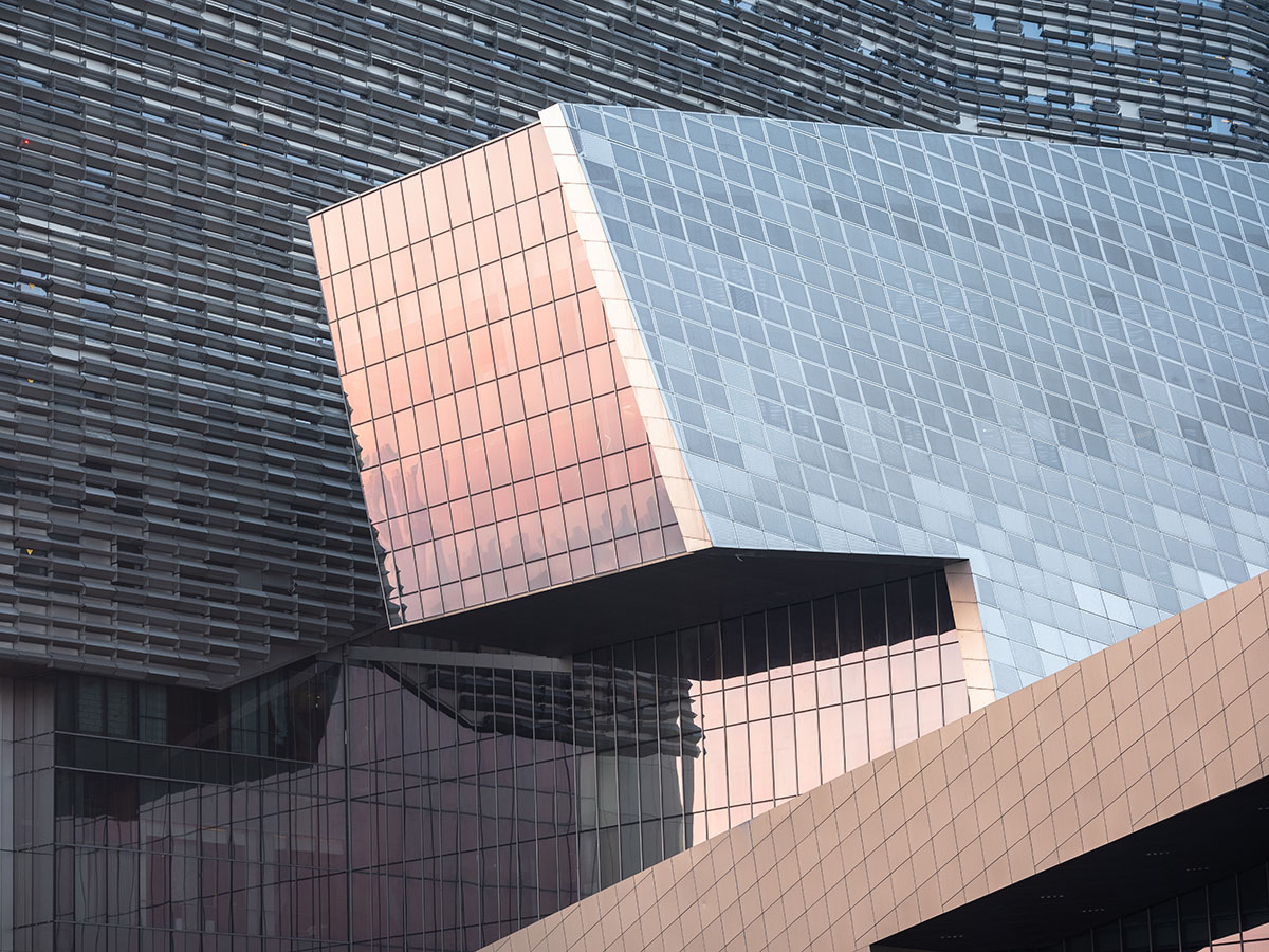 Morphosis designs conference center featuring undulating podium clad in titanium panels in China 