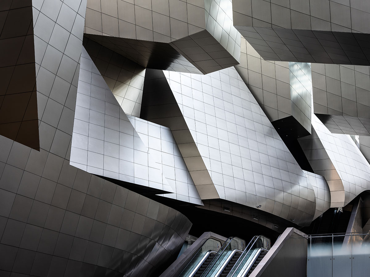 Morphosis designs conference center featuring undulating podium clad in titanium panels in China 