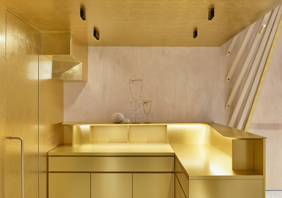 Golden and powder-colored details dominate forte_forte forte dei Marmi boutique in Italy