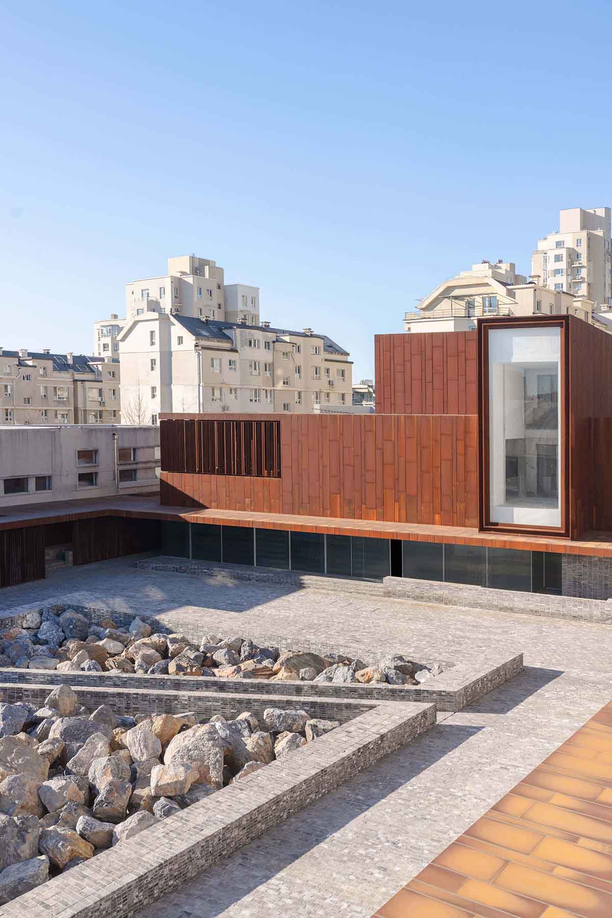 Neri&Hu revitalizes urban memory with corten steel volume in Dalian, China