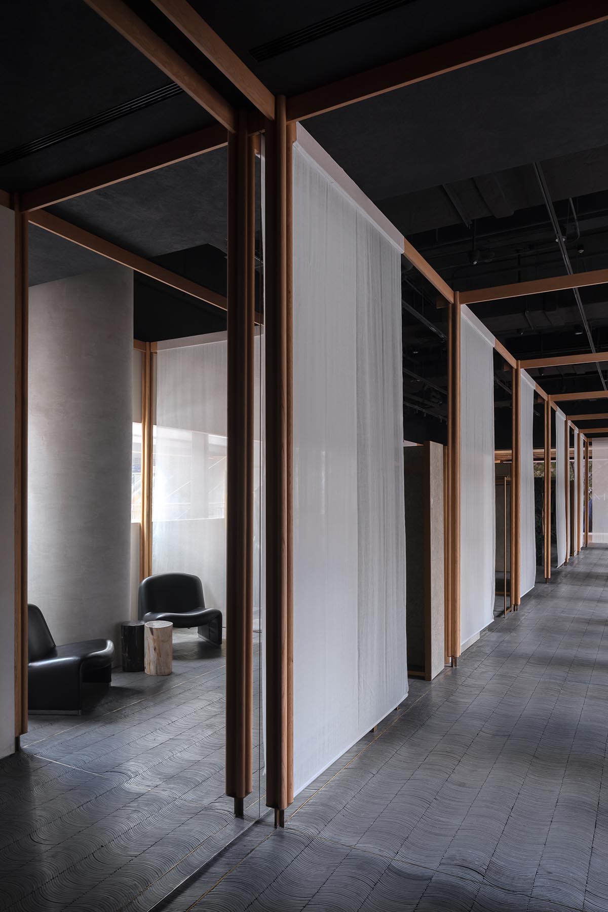 Neri&Hu adds fabric, marble and wooden panels to atelier evoking the spirit of textile-making