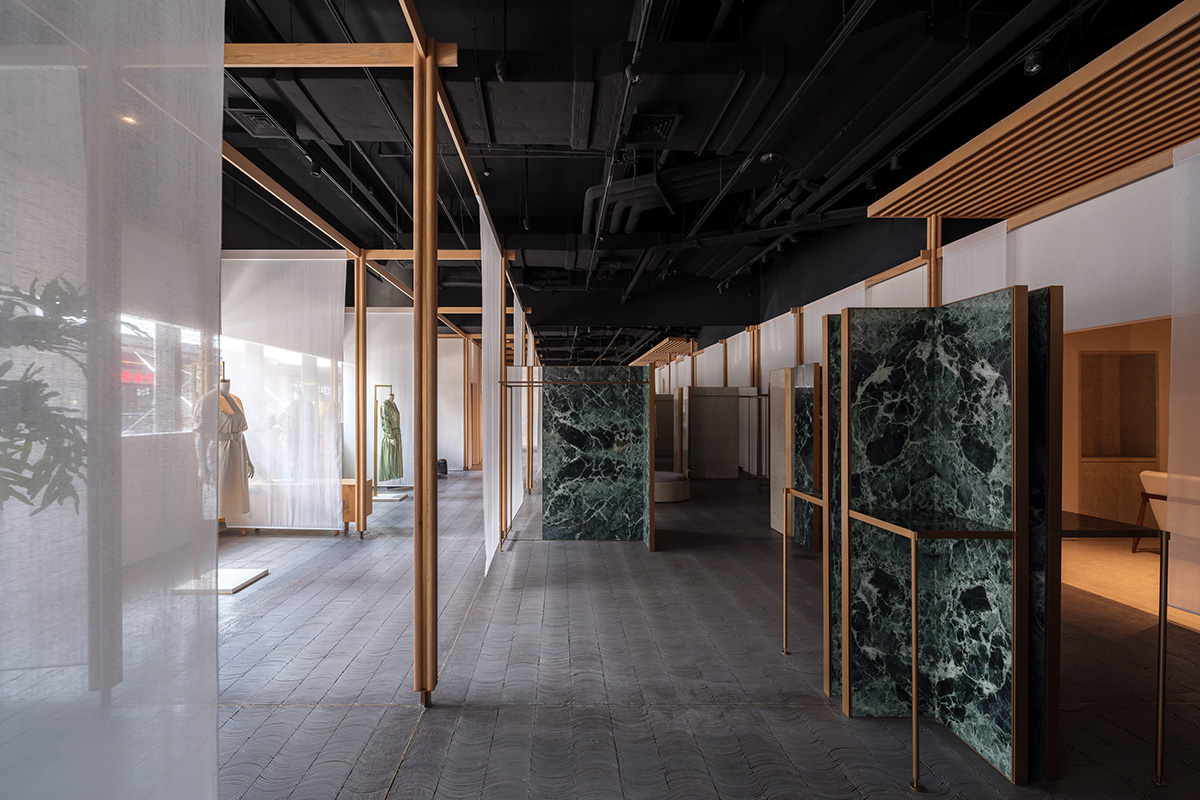 Neri&Hu adds fabric, marble and wooden panels to atelier evoking the spirit of textile-making