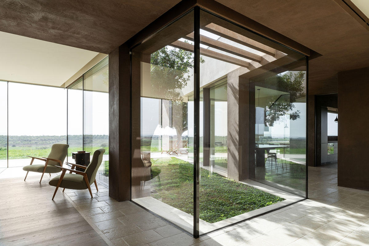 Holiday villa by Westway Architects comprises three distinct volumes made of Note stone in Italy 