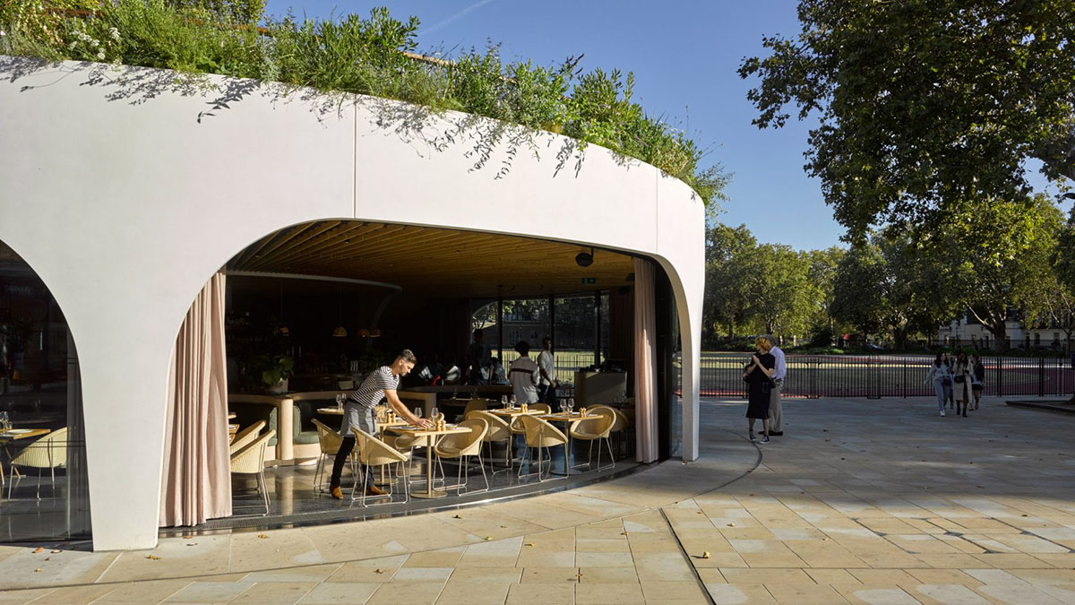 NEX designed restaurant with spiralling concrete wall and retractable curved glass system in London