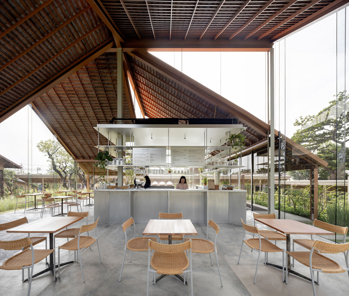 NITAPROW designed Patom Cafe with four segmented roof and thatched-roof walkway in Thailand