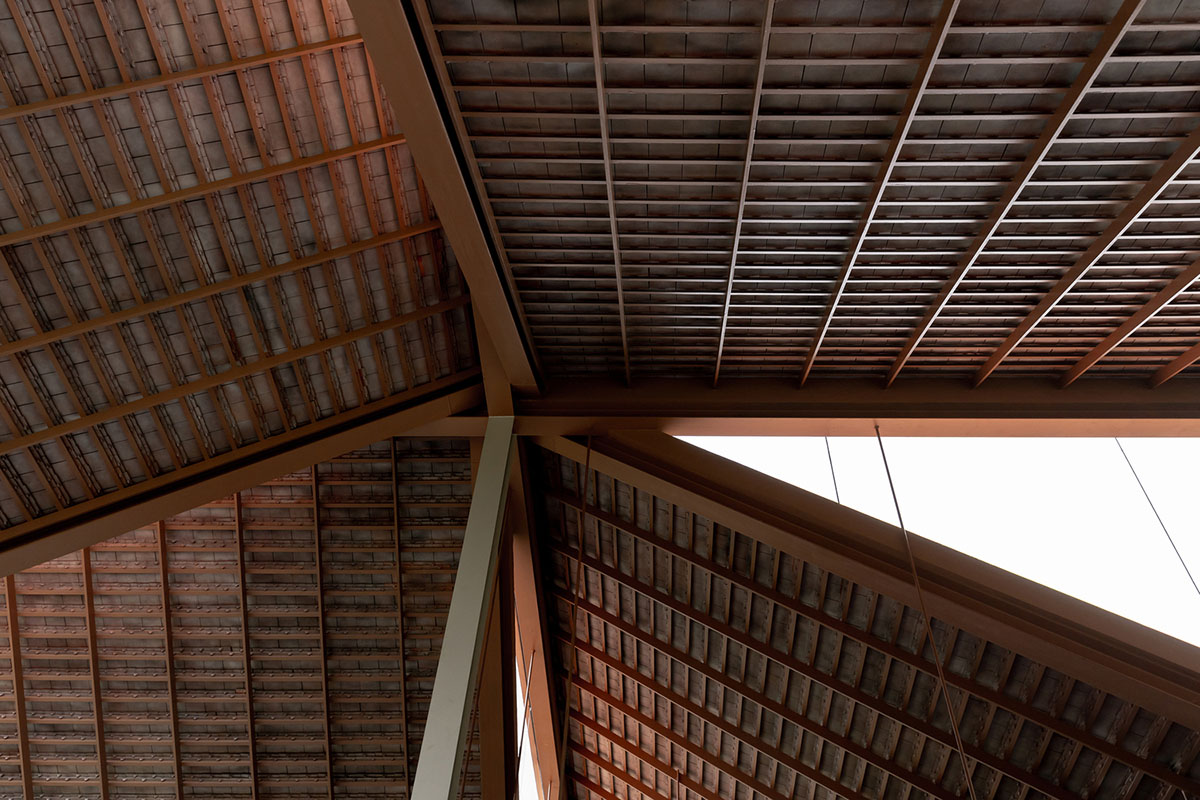 NITAPROW designed Patom Cafe with four segmented roof and thatched-roof walkway in Thailand