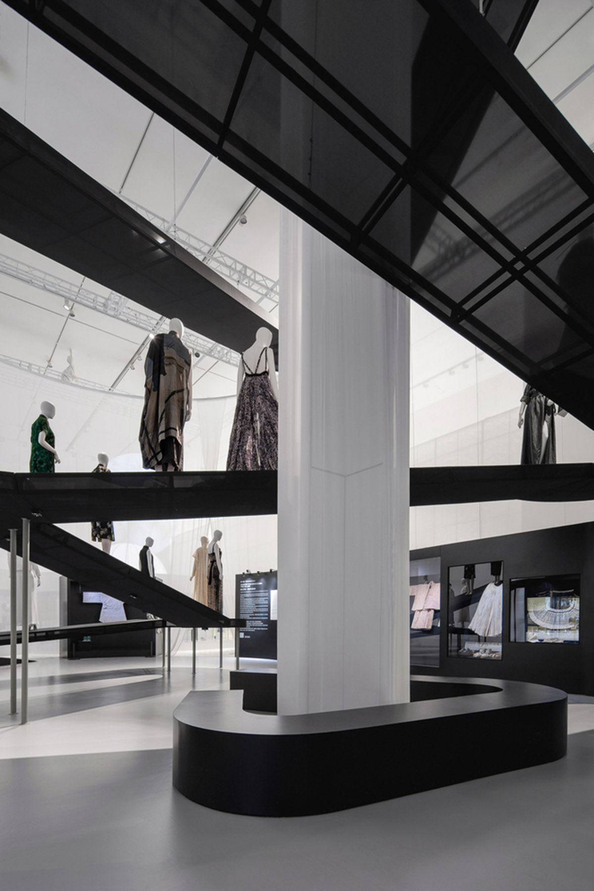 Studio 10 designs exhibition space with white tubular structures and black translucent ramps in China