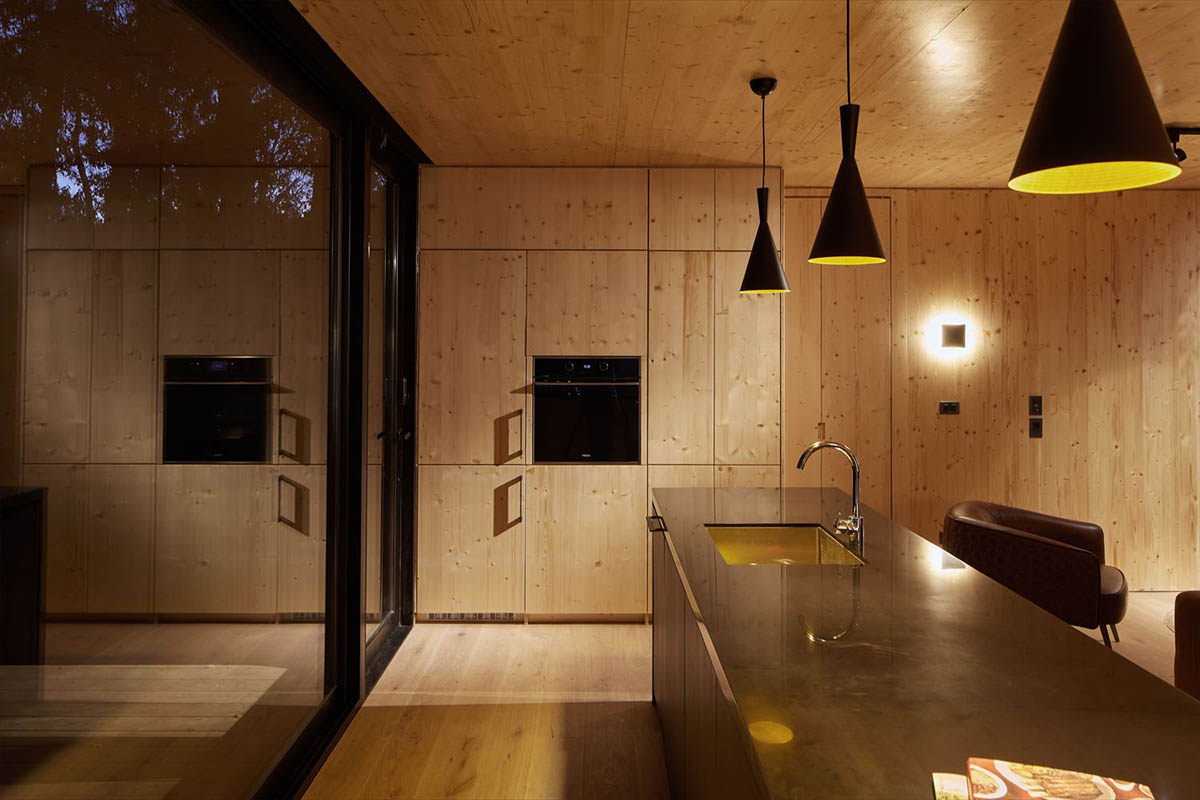 Black wooden cabin by iHouse estudio is an off-grid escape home in Uruguayan native forest