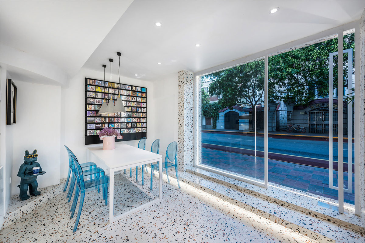 This tiny cafe by TOUCH Design is dotted with white and orange interwoven terrazzo details in Tianjin
