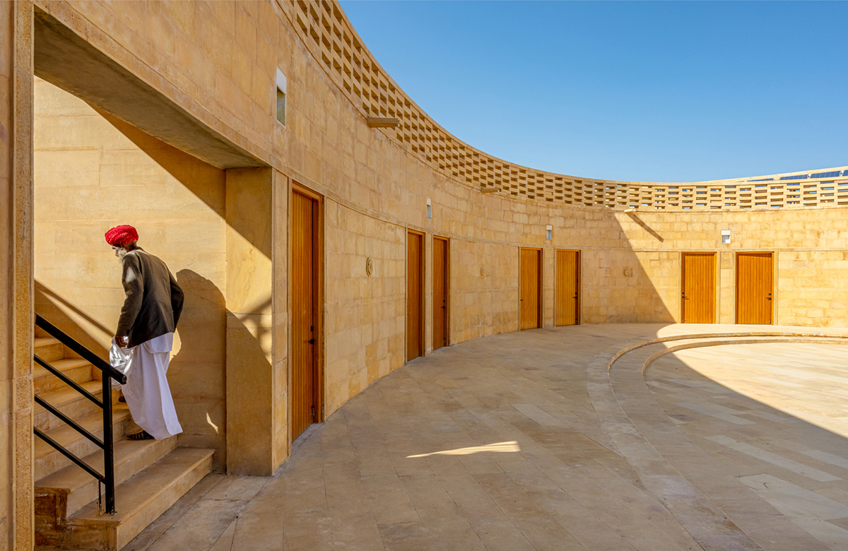 Diana Kellogg Architects' oval-shaped girl's school is made of hand-carved sandstone in rural India