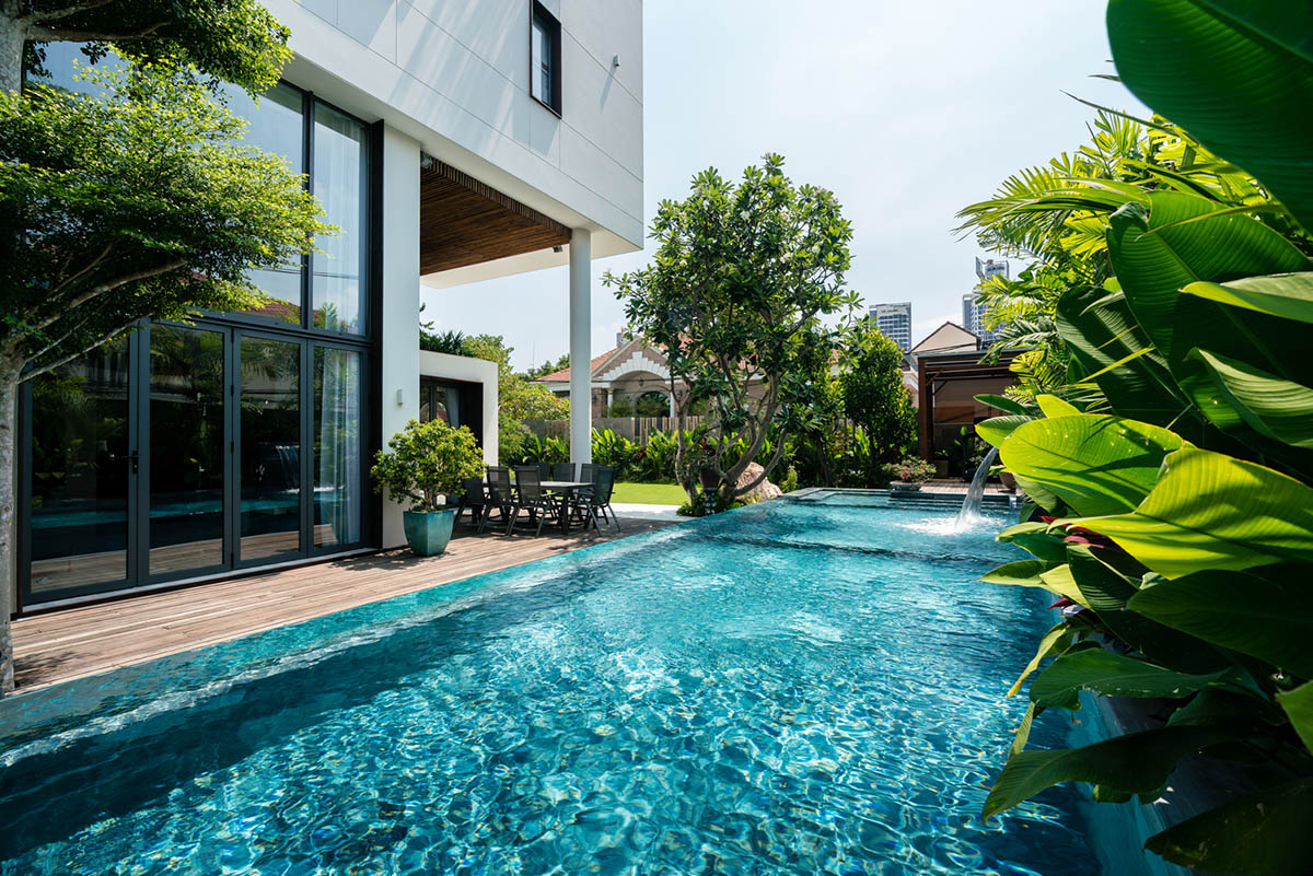 QBi Corp. designs residence with different volumetric composition and sloping green roof in Vietnam