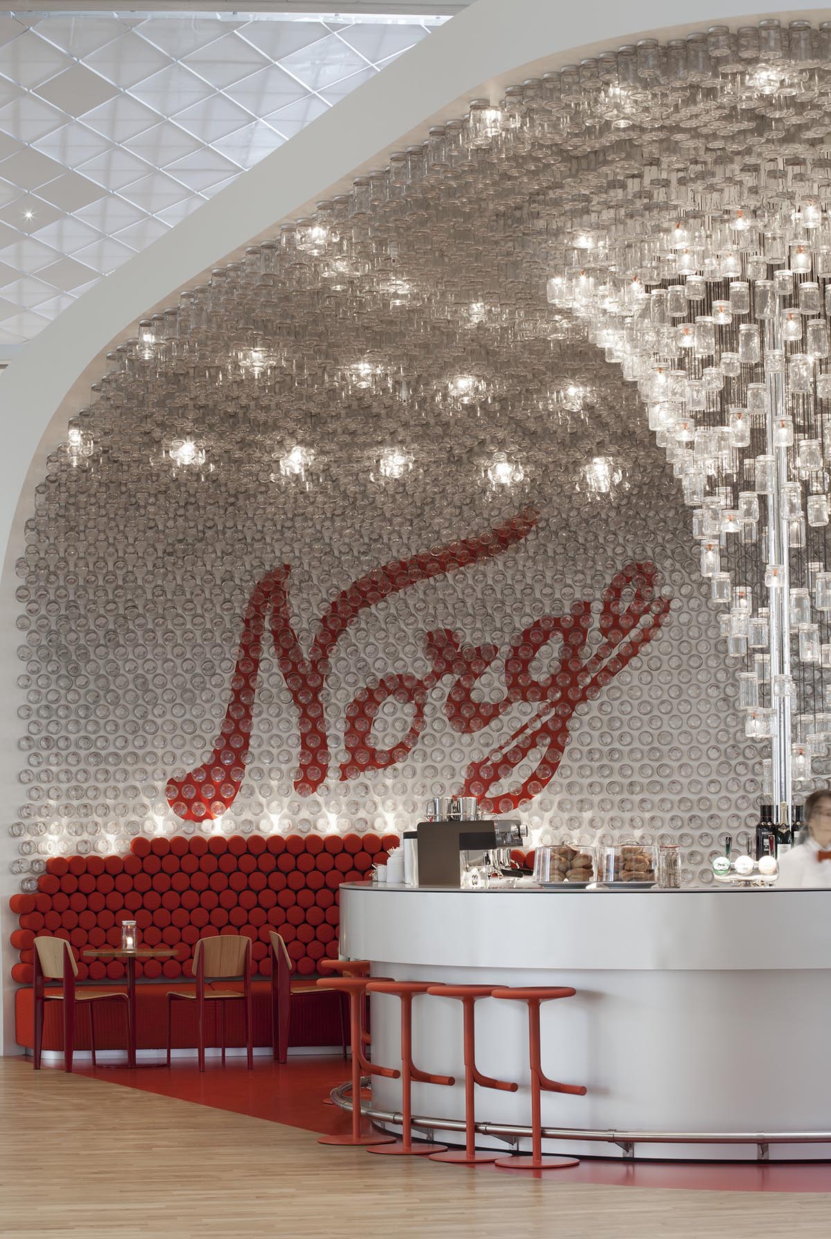 Snøhetta uses more than 4000 original Norgesglasset jars to create crystallized bar in Oslo’s airport