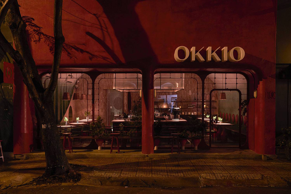 Red5studio built cafe evoking a retro spirit with hues of red colors and lights in Vietnam