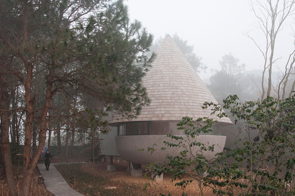 ZJJZ completes a mushroom-formed wood house in a pine forest of Jiangxi