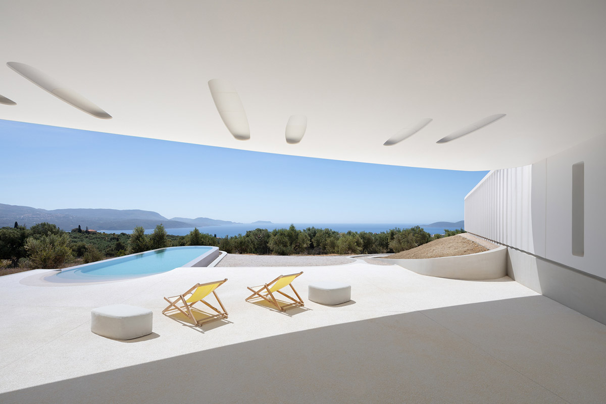 LASSA architects forms rounded walls for house to provide meditative courtyards in Greek olive grove