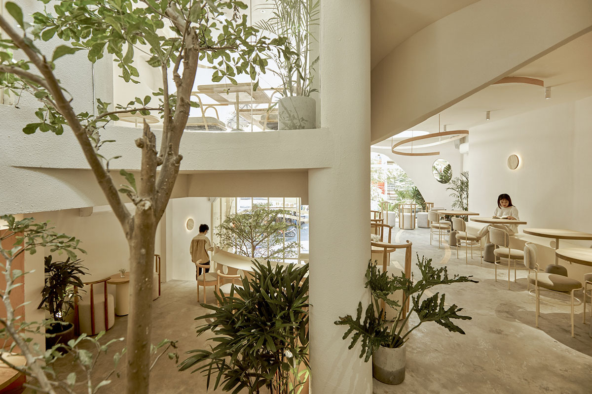 September Cafe is designed to look like a bird's nest with curved steel stripes in Vietnam